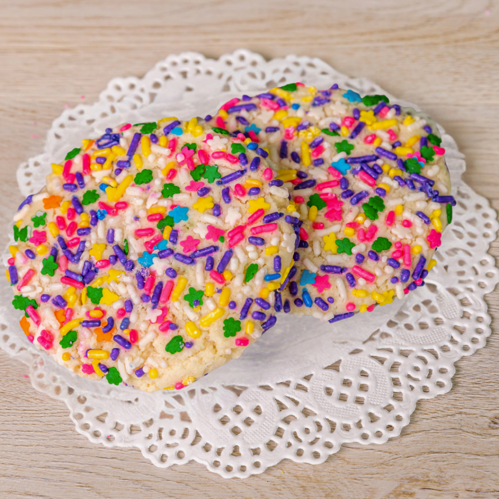 Colorful sprinkled rice crispy treats on lace doily