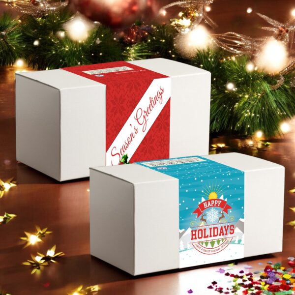 Holiday gift boxes with festive greetings on wooden table