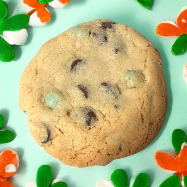 Chocolate chip cookie with colorful candy pieces.