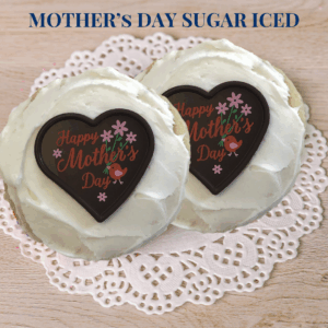 Mother's Day themed cupcakes with heart-shaped decorations
